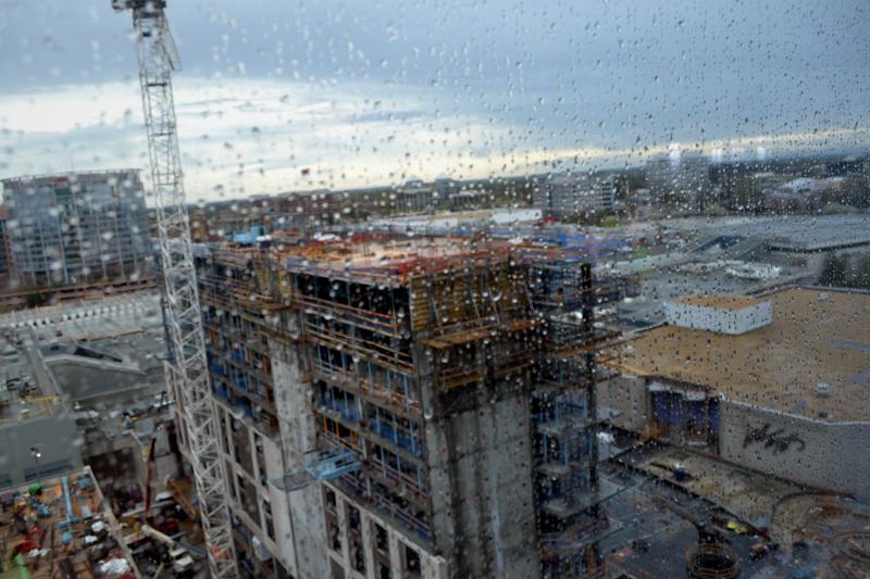 Hyatt Hotel construction through a rainy window of Tysons Tower
