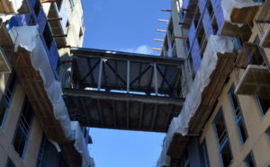 The sky bridge under construction at Kingston apartments